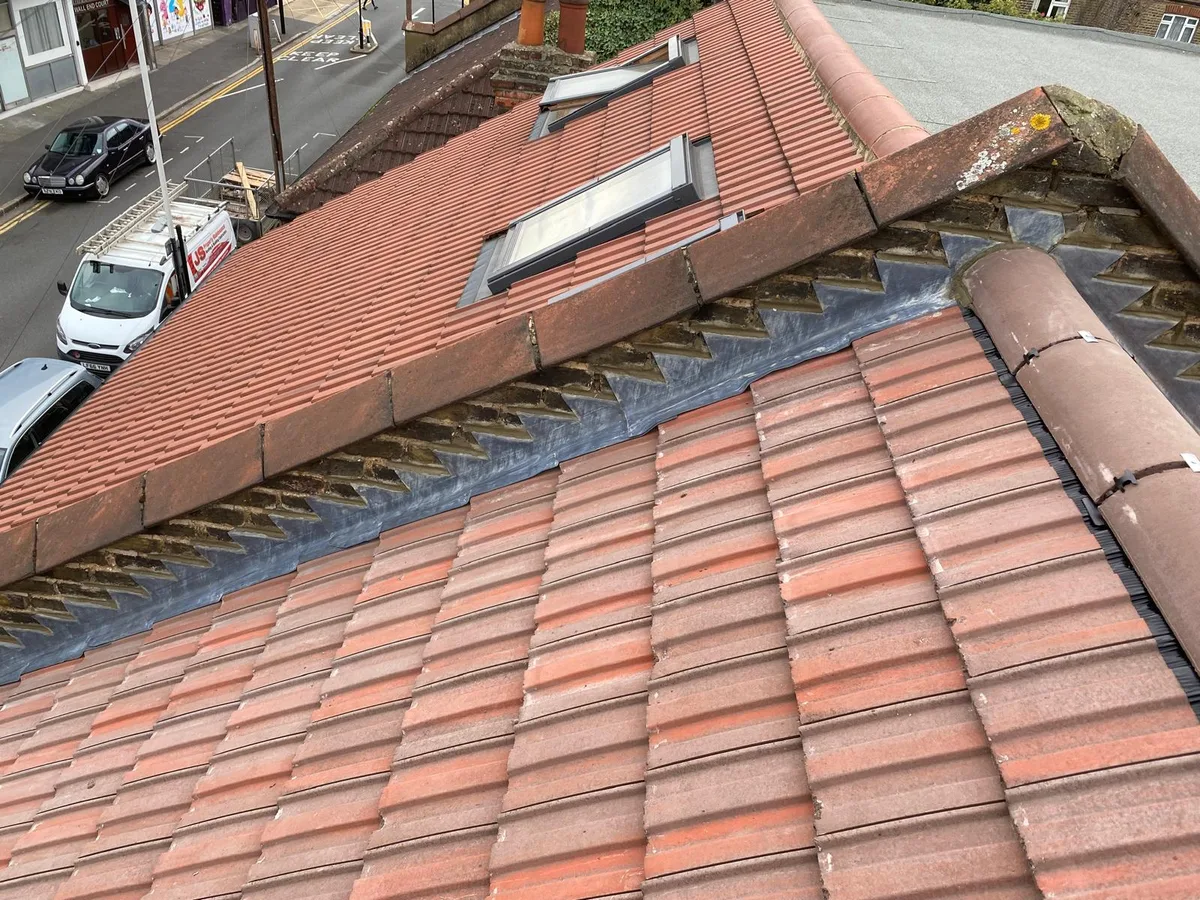 A hipped tiled roof completed
