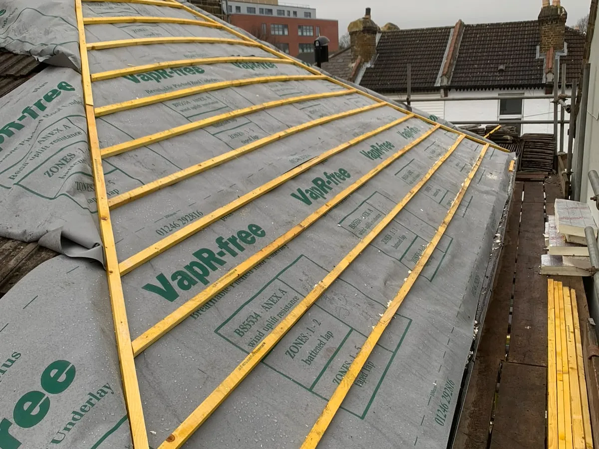 A new roof underway with fresh membrane and battens