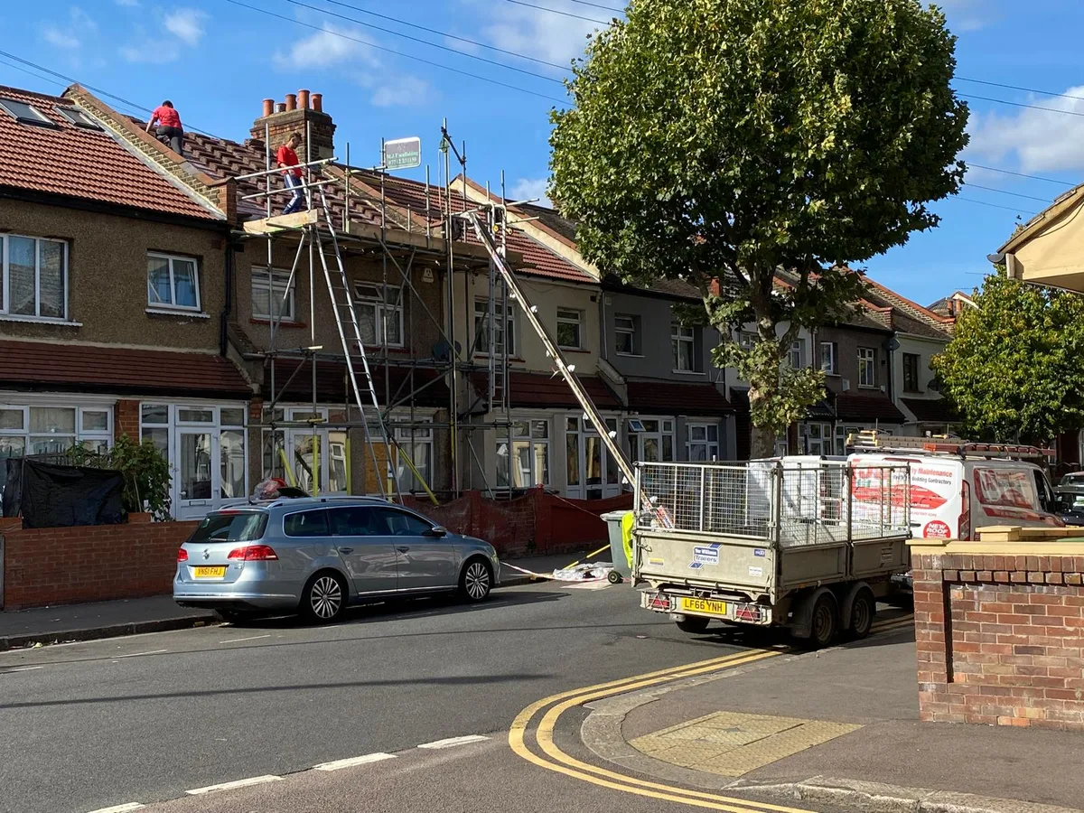 Our roofers at work on full scaffold