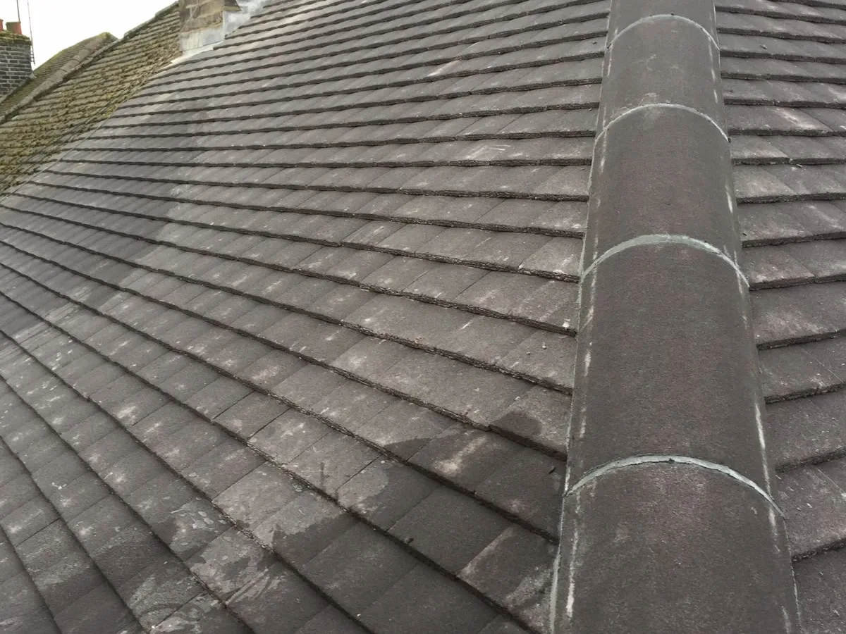 A newly finished tiled roof ridge